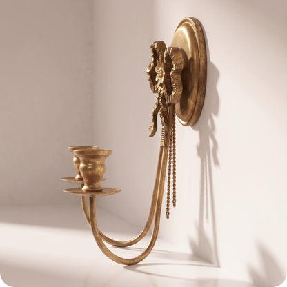 Candelabro dorado con moño y dos porta velas