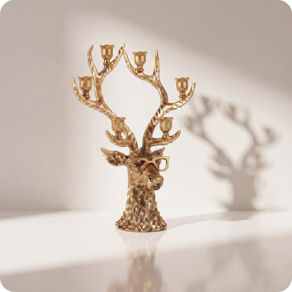 Candelabro dorado de reno con lentes