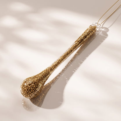 Esfera Gota de vidrio, cuentas doradas y purpurina