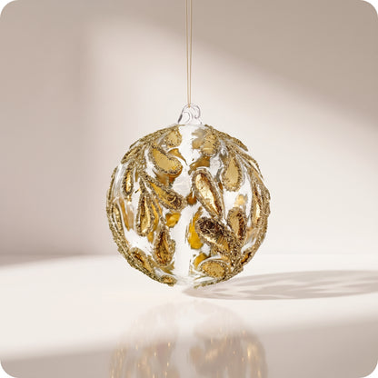 Esfera de vidrio, hojas de oro transparente, purpurina dorada