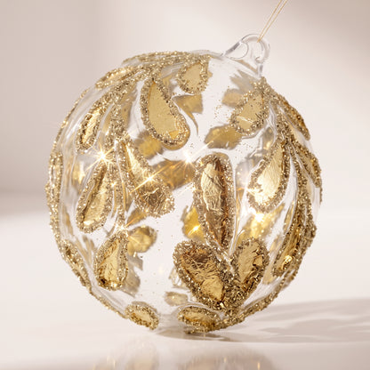 Esfera de vidrio, hojas de oro transparente, purpurina dorada