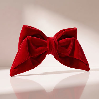 Moño rojo, 18 x 10 cm.
