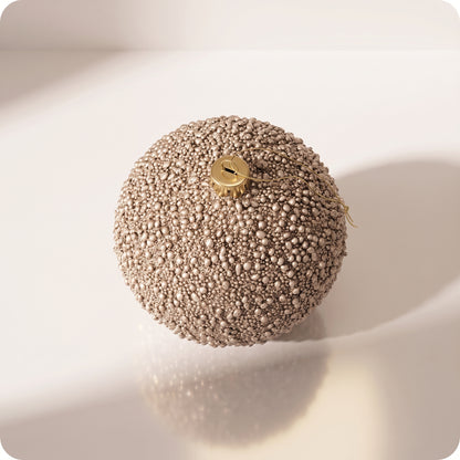 Esfera con glitter y mini piedras champagne 16 cm