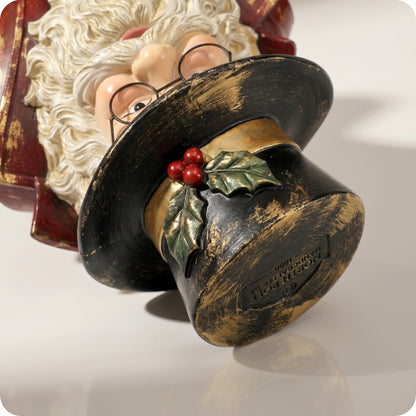 Papá noel de resina sobre pedestal