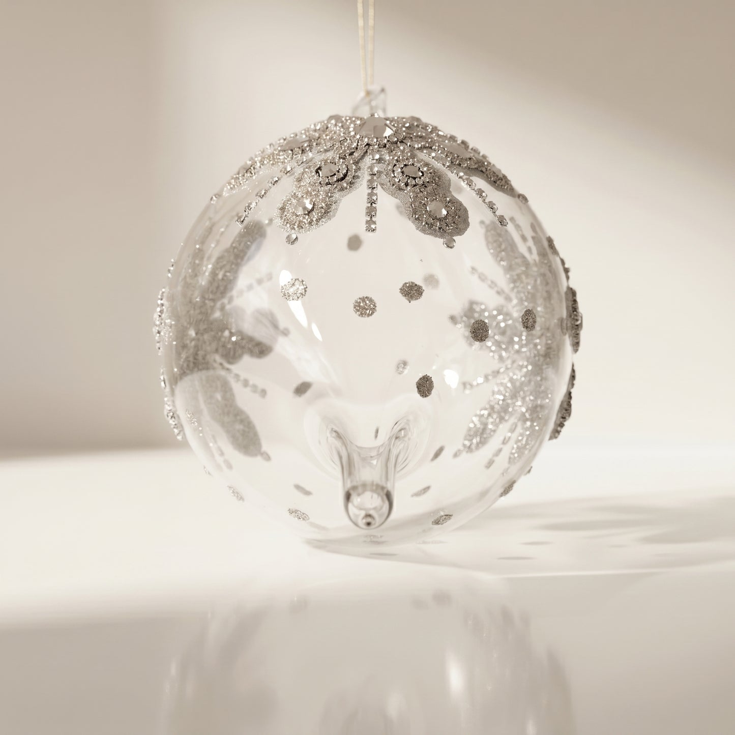 Esfera de vidrio de copo de nieve con purpurina