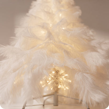 Árbol blanco con luces LED en el tronco